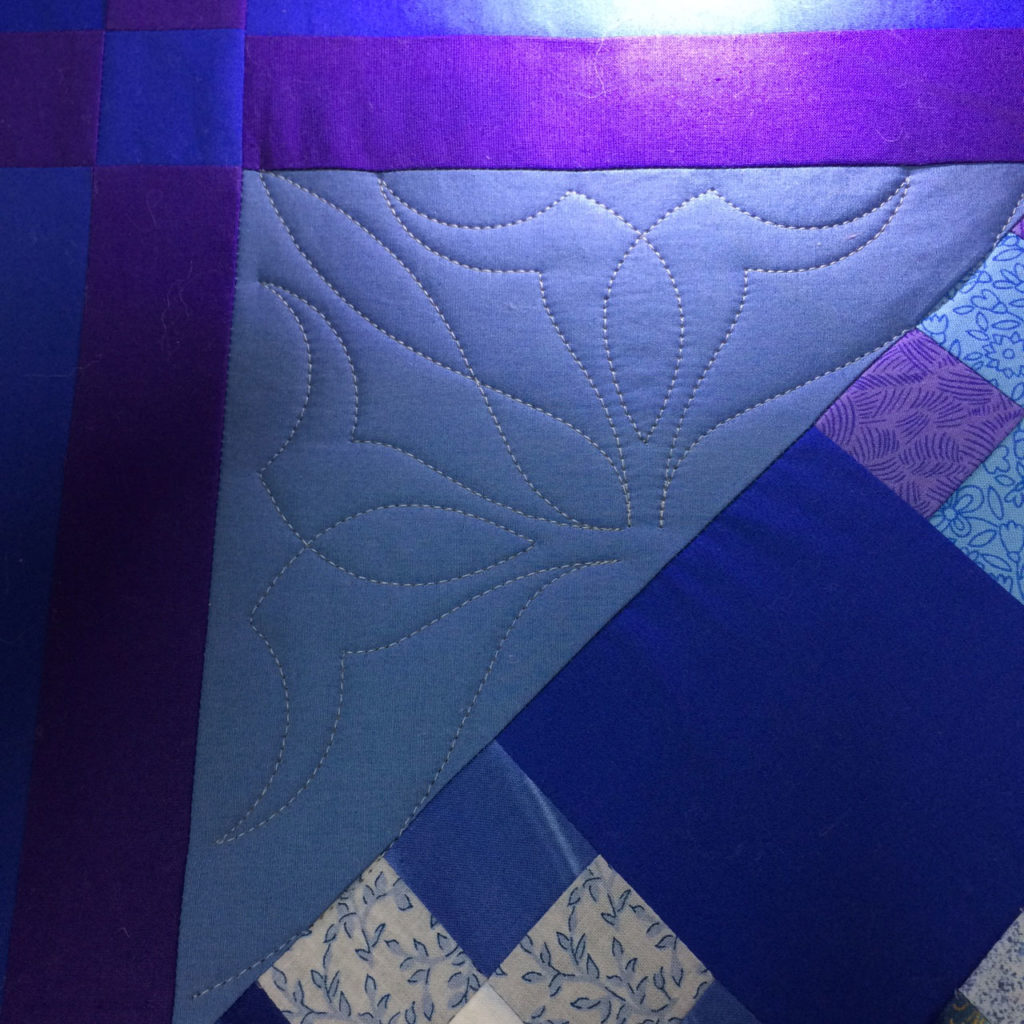 Getting started by quilting a corner triangle at a 45-degree angle