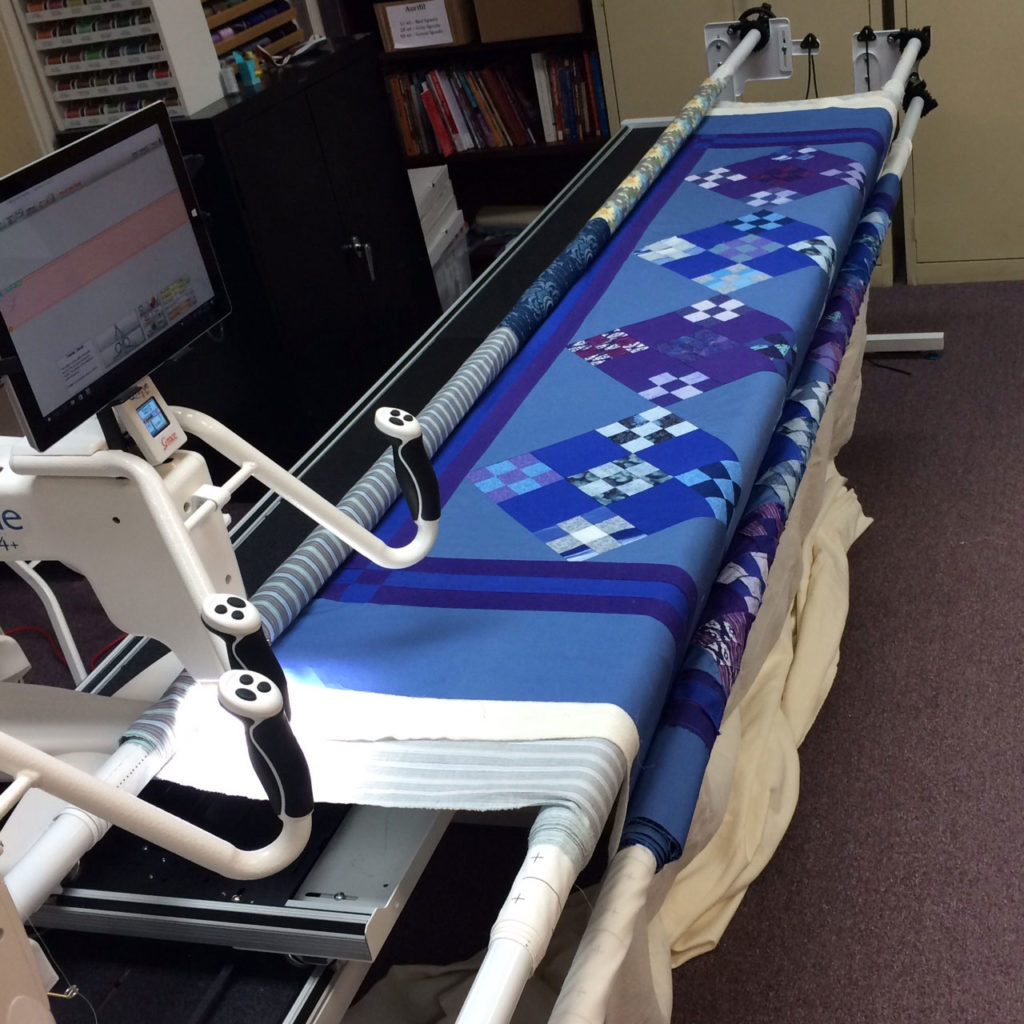 The longarm frame loaded and ready for quilting.
