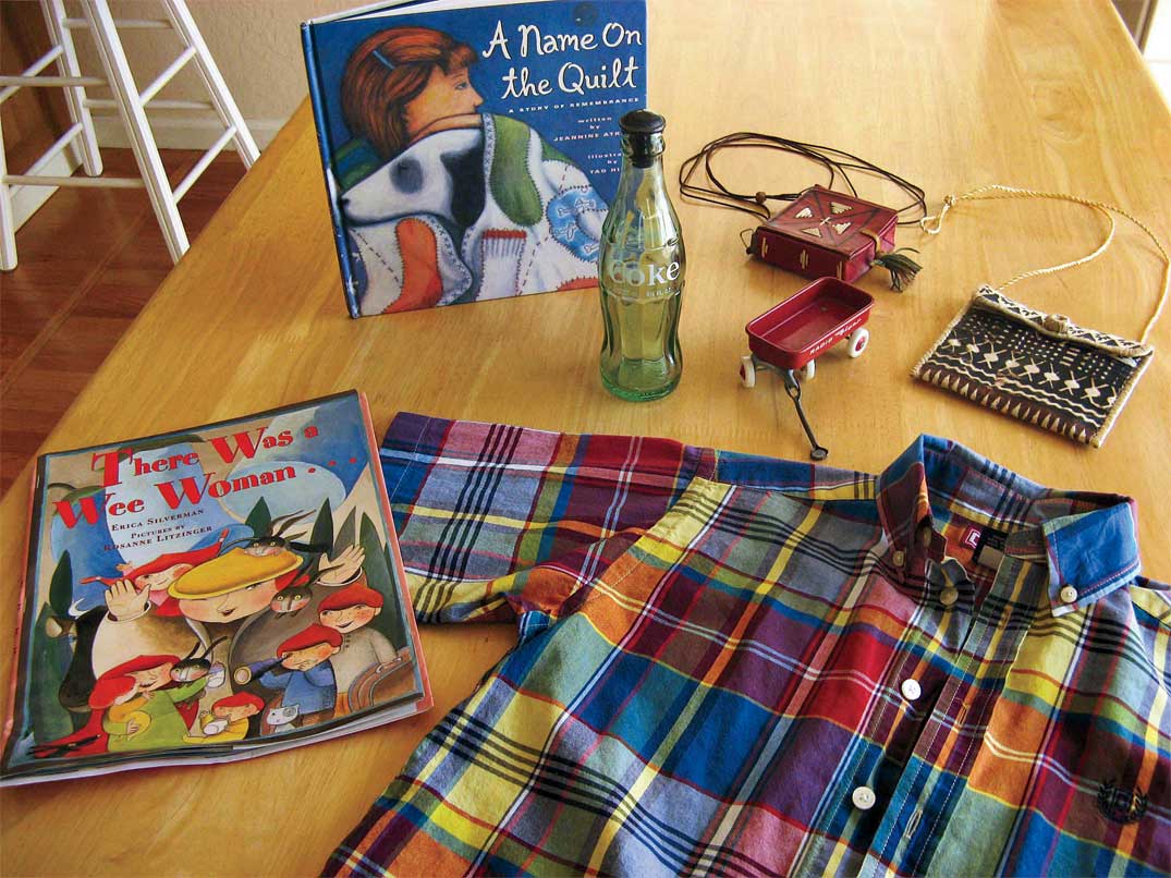 Finds from a morning visit to the Flea included (clockwise from top left): a children’s book about the AIDS quilt; a Coke bottle with sprinkler cap used to dampen clothes before ironing (from the days before steam irons); a toy version of the Radio Flyer, the iconic red wagon of my childhood; a small red leather purse with decorative raffia stitching, origin unknown; a small purse covered with hand-printed paper, perhaps from Indonesia; a boy’s plaid shirt (price: 45 cents); and a children’s book with fanciful illustrations and a book jacket I can frame.