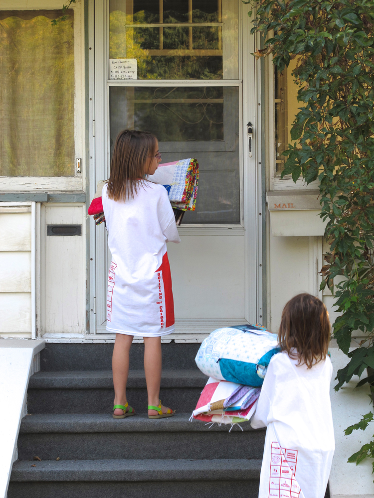 Giving is a way of life for these children who helped deliver charity quilts to those in need.