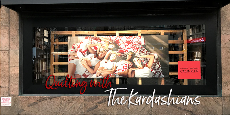 Macy's window display featuring the new Kardashian clan ad with Calvin Klein.